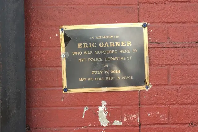 A makeshift plaque marks the spot where Eric Garner was brought to the ground by Officer Daniel Pantaleo.